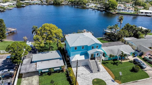 birds eye view of property with a water view