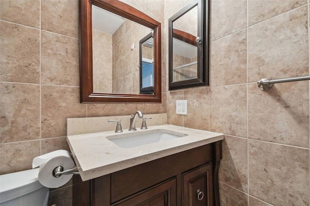 bathroom with toilet and vanity