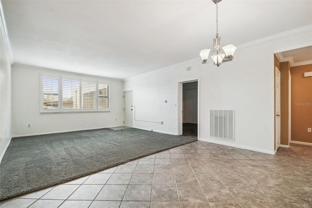 spare room with light tile patterned floors, ornamental molding, and an inviting chandelier