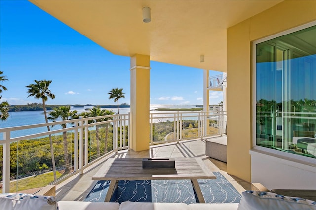 balcony featuring a water view