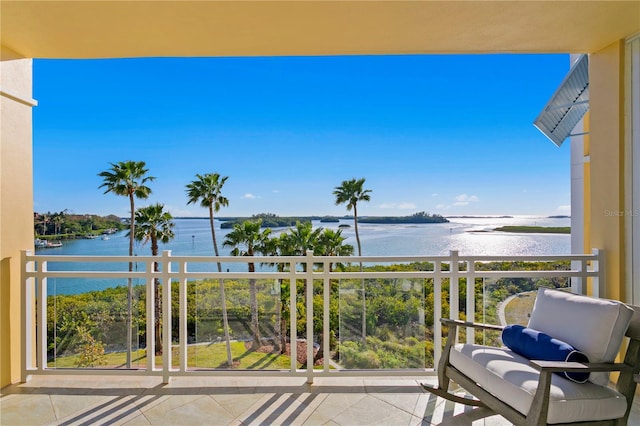 balcony featuring a water view