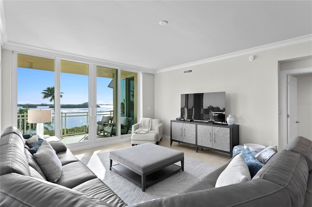 living room with ornamental molding and a water view