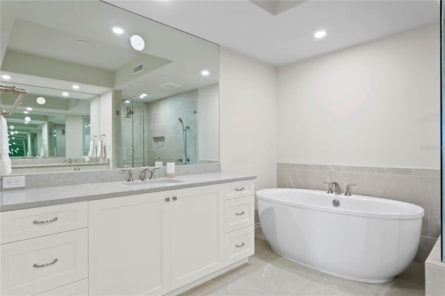 bathroom with vanity and tile flooring