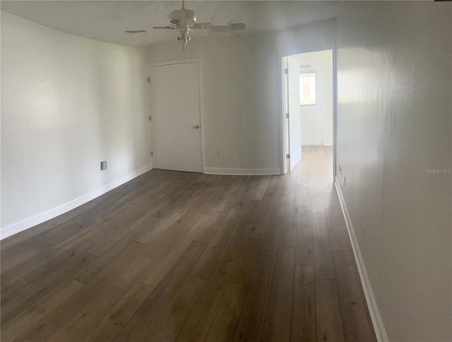 unfurnished room with ceiling fan and dark hardwood / wood-style floors