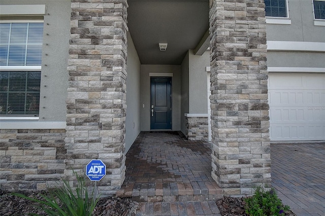 doorway to property featuring a garage