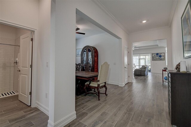 corridor with crown molding and dark hardwood / wood-style floors