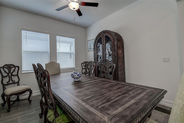 dining space featuring dark hardwood / wood-style floors and ceiling fan