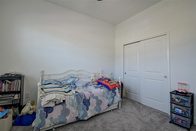 bedroom with a closet and carpet