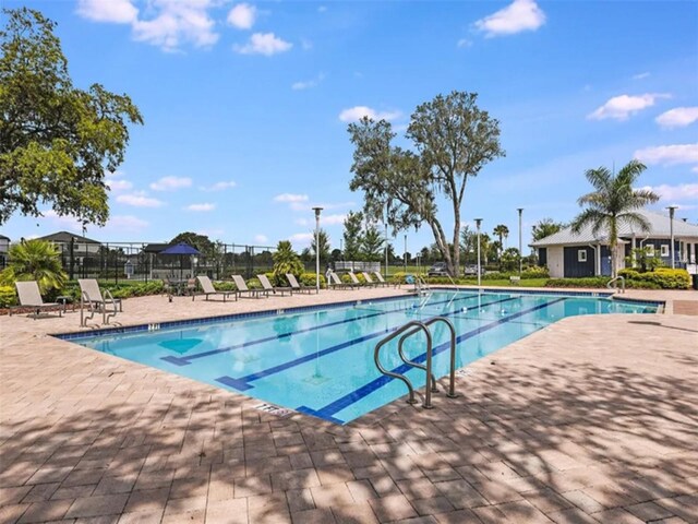 view of swimming pool with a patio