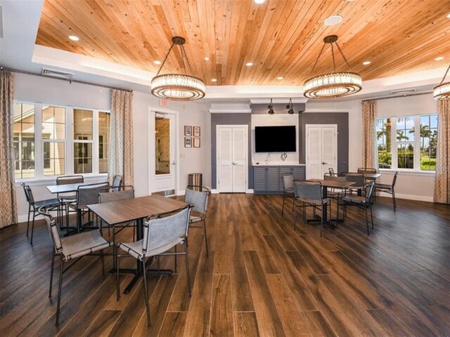 dining area with wood ceiling, dark hardwood / wood-style floors, a raised ceiling, and a chandelier