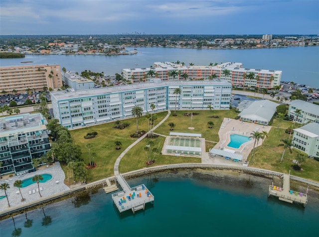 drone / aerial view with a city view and a water view