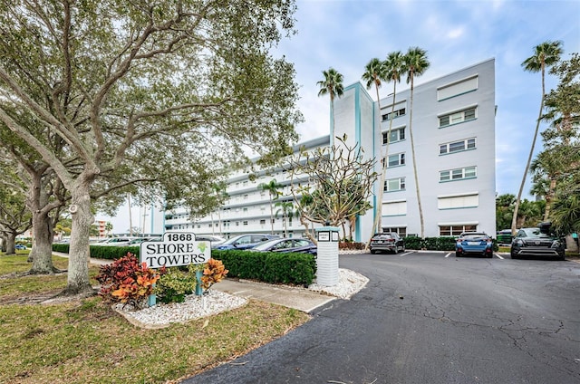 view of building exterior featuring uncovered parking