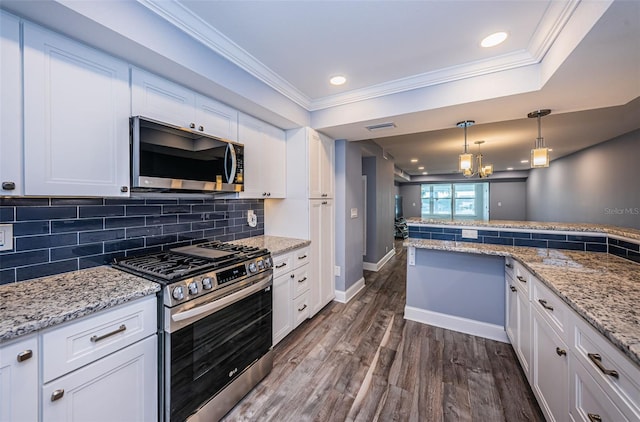 kitchen featuring dark wood-style floors, visible vents, ornamental molding, white cabinets, and appliances with stainless steel finishes