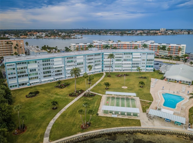 drone / aerial view featuring a water view and a view of city