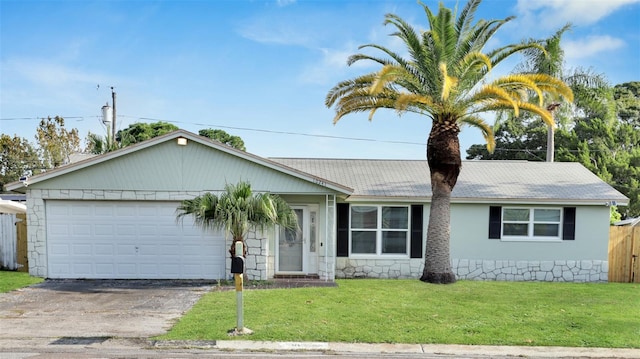 ranch-style house with a front yard and a garage