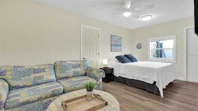 bedroom with ceiling fan and light hardwood / wood-style flooring