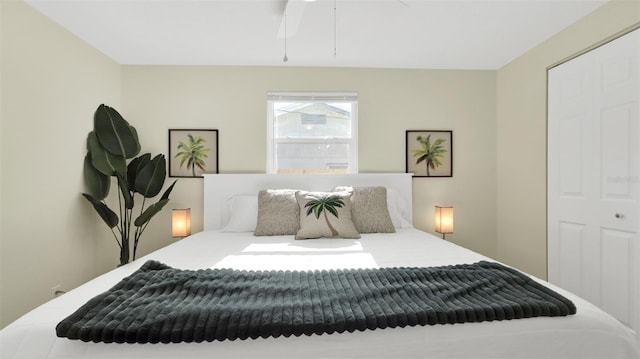 bedroom featuring ceiling fan and a closet