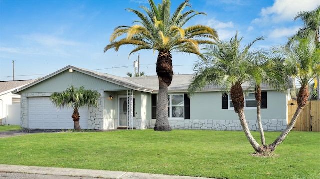 ranch-style house with a front yard and a garage