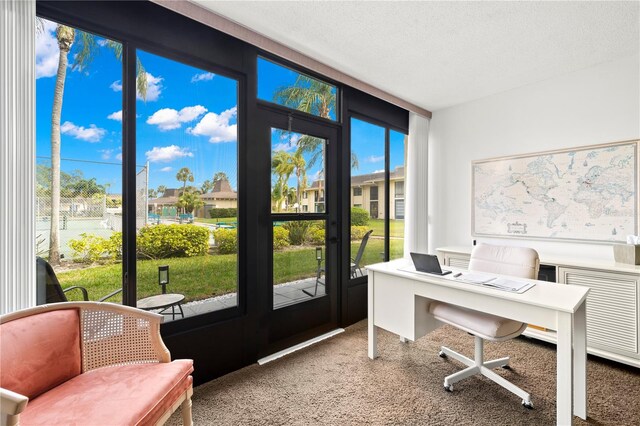 office area with light carpet and a textured ceiling