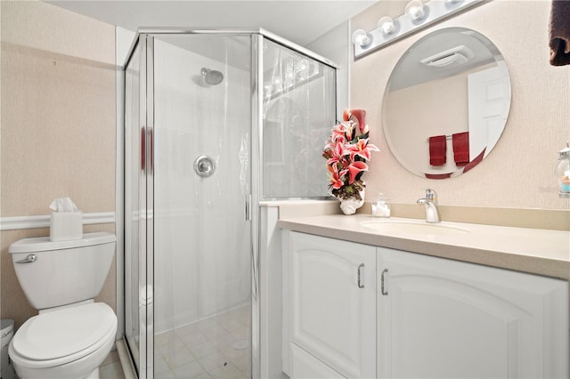 bathroom with an enclosed shower, toilet, and vanity