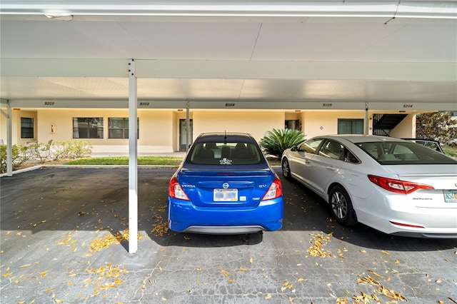 exterior space with a carport