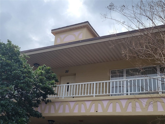 view of home's exterior with a balcony