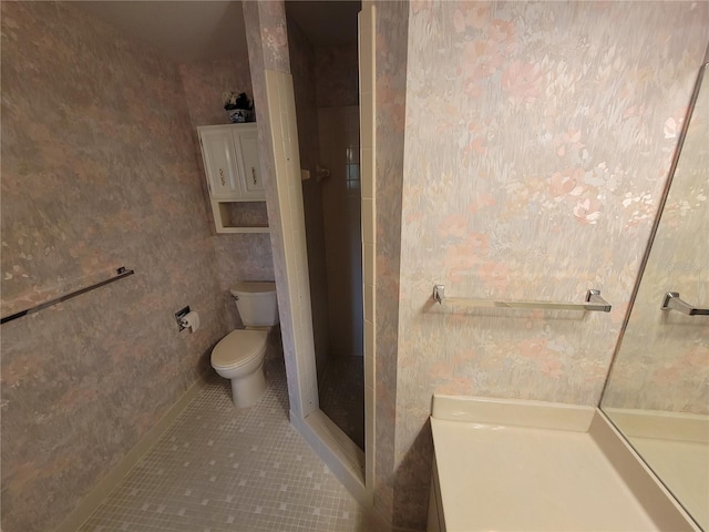 bathroom featuring walk in shower, tile flooring, and toilet