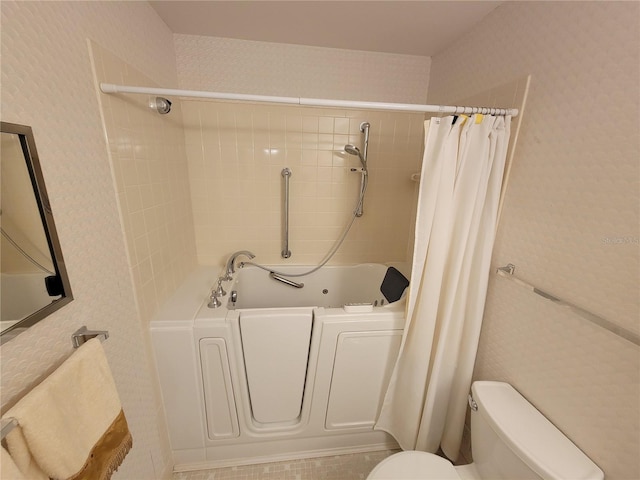 bathroom with toilet and shower / bathtub combination with curtain