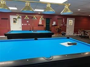 playroom with pool table and a paneled ceiling