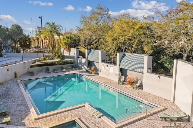 view of pool featuring a patio