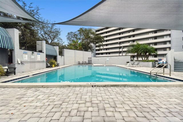 view of swimming pool featuring a patio