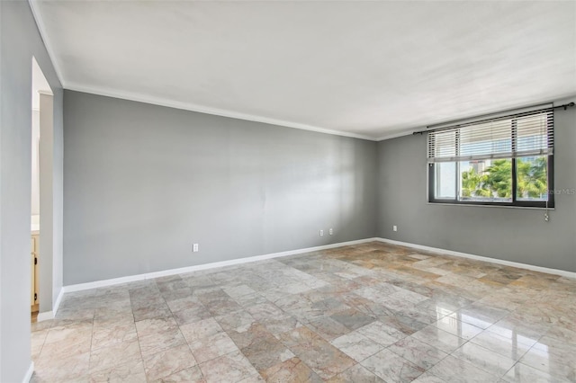 spare room with light tile floors and ornamental molding