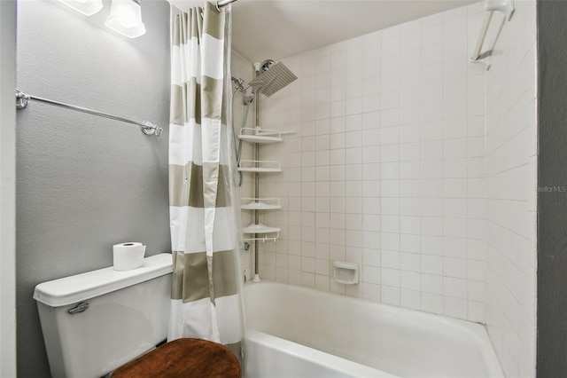 bathroom featuring shower / bath combo with shower curtain and toilet