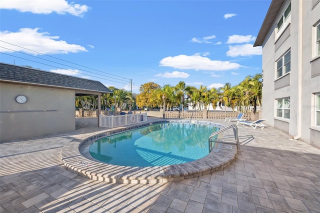 view of swimming pool with a patio area