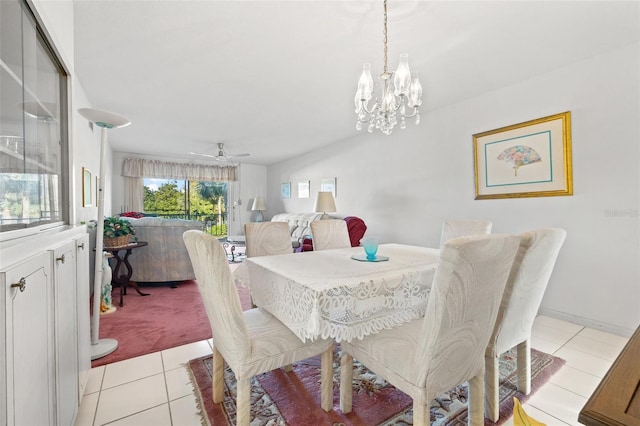 tiled dining room featuring ceiling fan