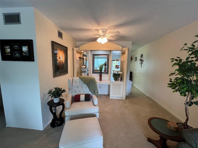 interior space with a textured ceiling and carpet