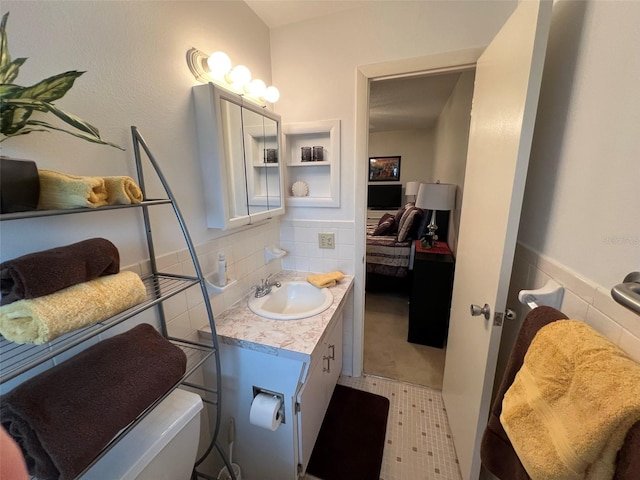 bathroom with tile patterned flooring and vanity