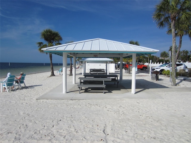 view of community with a gazebo and a water view