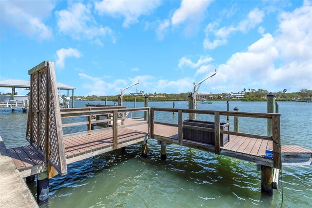 dock area featuring a water view and central AC unit