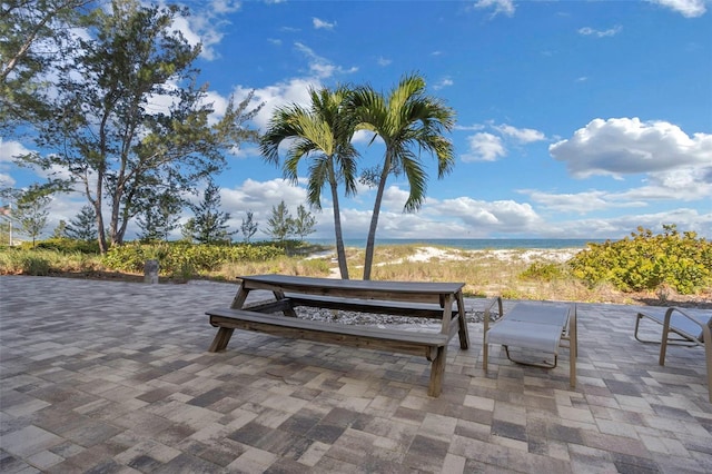 view of community with a view of the beach and a water view