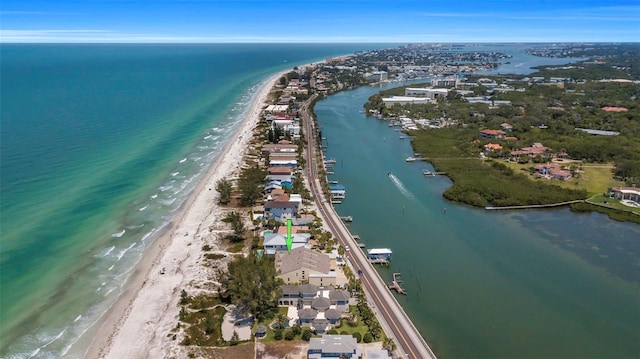 aerial view with a water view and a view of the beach