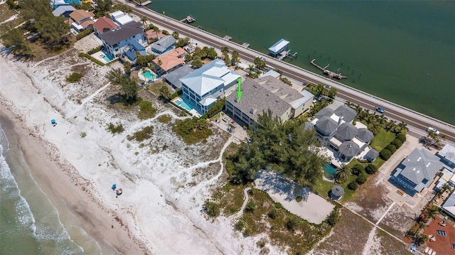 aerial view featuring a view of the beach and a water view