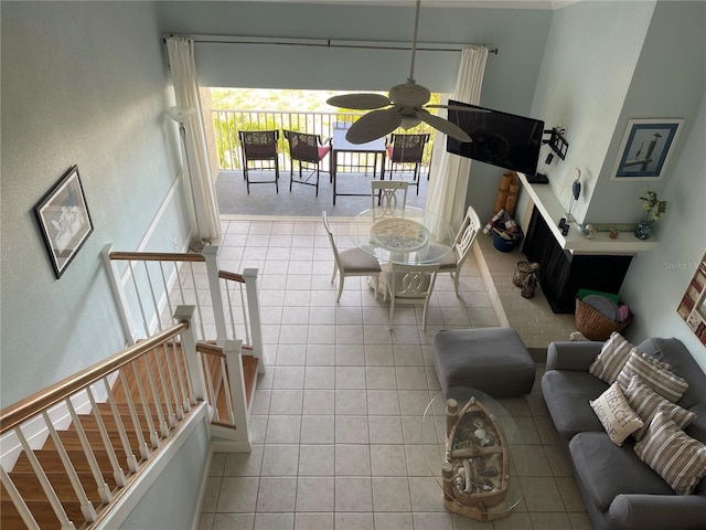 living room with ceiling fan and light tile patterned floors