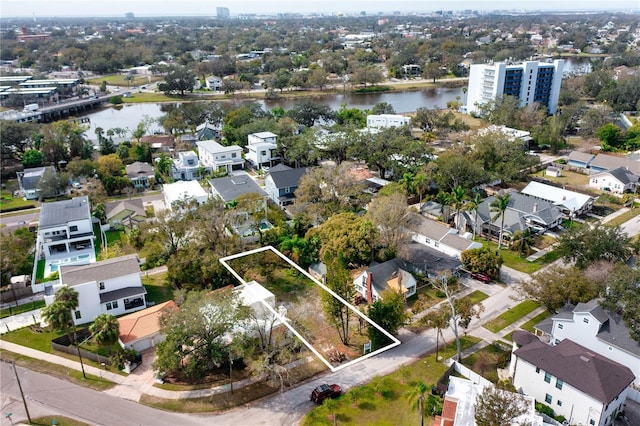 drone / aerial view with a residential view and a water view