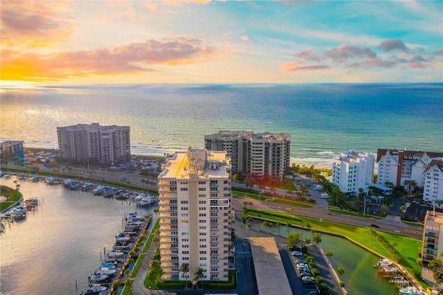 aerial view at dusk with a water view