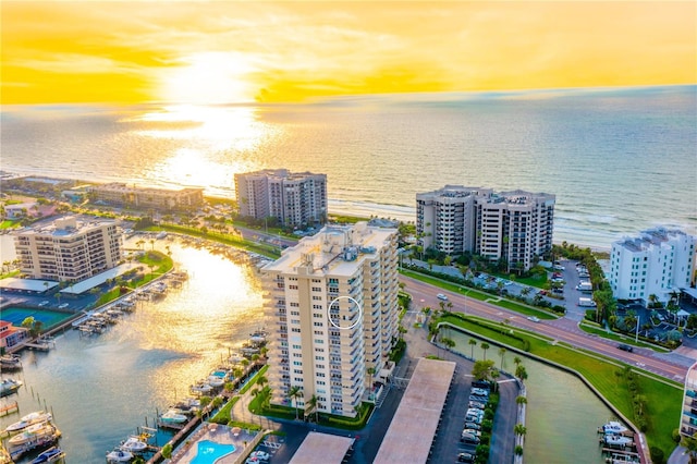 aerial view at dusk with a water view