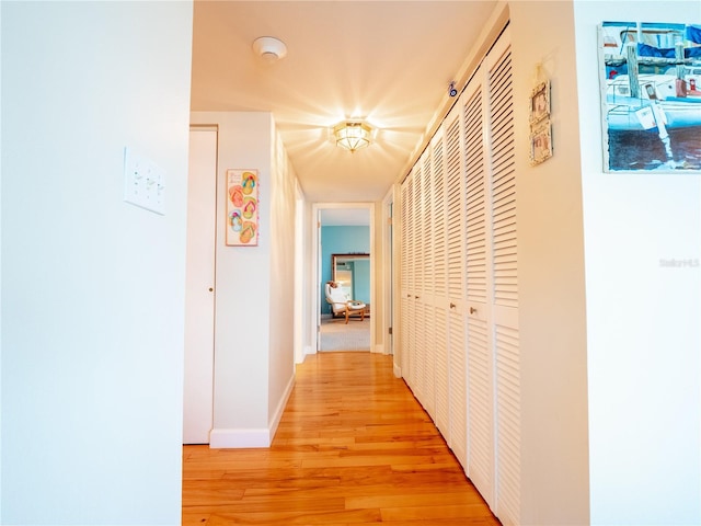 hall with light wood-type flooring