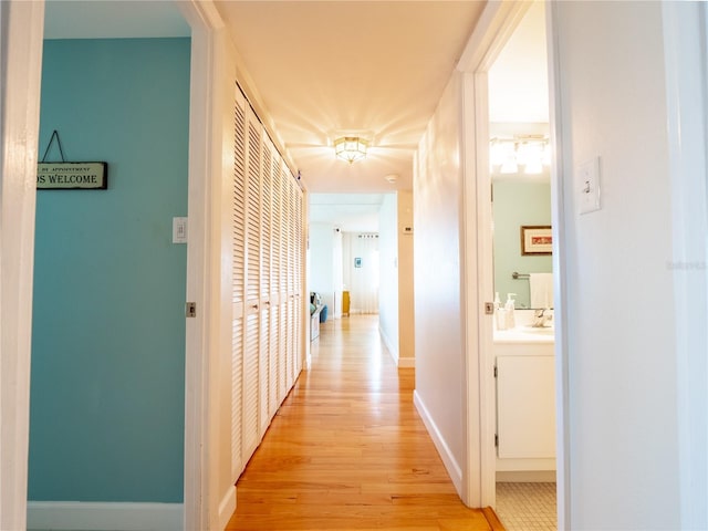 hallway featuring light wood-type flooring