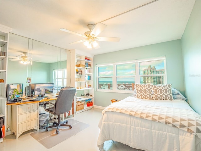 bedroom with ceiling fan and multiple windows