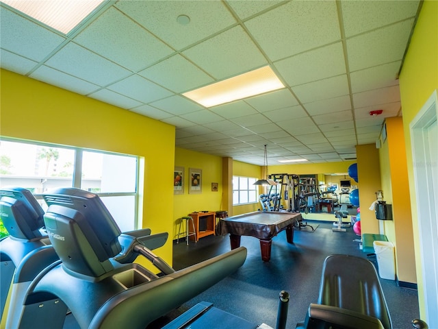 game room with a paneled ceiling, billiards, and plenty of natural light